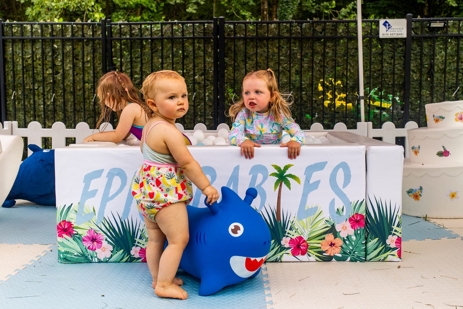 Toddlers playing behind a tropical EPIC Babies soft-play fence