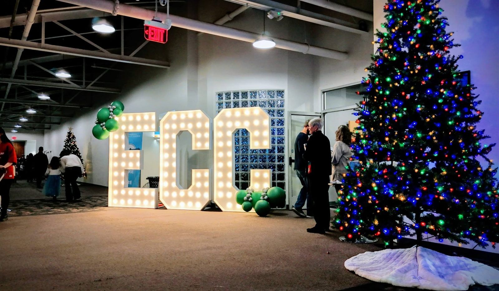 Festive holiday event styling with marquee letters, balloons, and a Christmas tree by EPIC Parties in Nashville